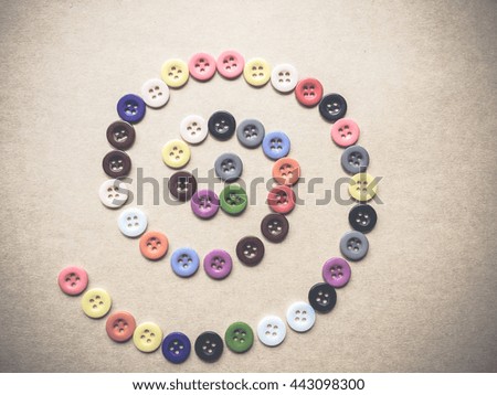 Multi color of button spread on brown paper