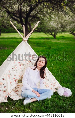 Pretty young lady in a tent