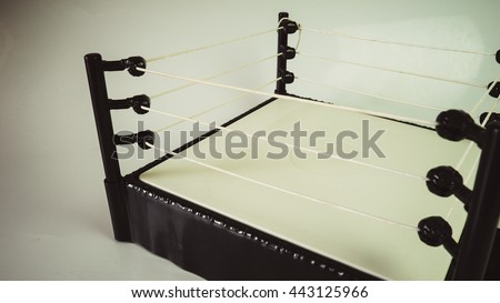 Retro styled or retro color  empty boxing or wrestling ring fighting competition arena. Concept of pro tournament. Slightly de-focused and close-up shot. Copy space.