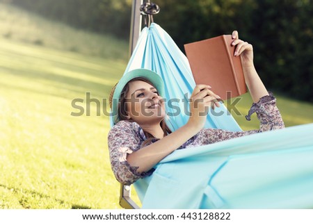 Picture of young woman relaxing in hammock