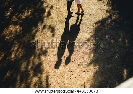 Beautiful couple walking in the forest Royalty-Free Stock Photo #443130073