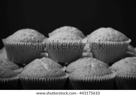Fresh cupcake desert before decoration. Selective focus. Shallow depth of field. Toned.