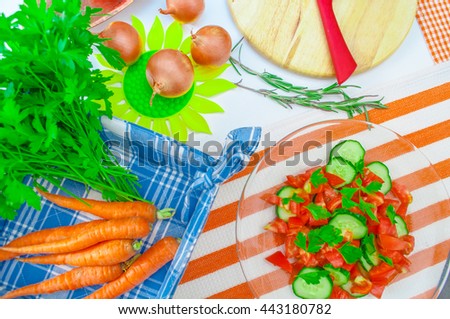 Top view of sliced vegetables on wooden cutting boards.
Female cook cutting bell pepper to make salad.
.Healthy veggies food, dieting concept, cooking.