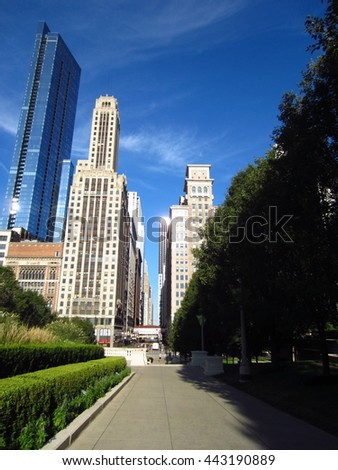 Walking path in Chicago park with skyline view