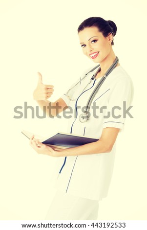 Attractive medicine student or doctor with book