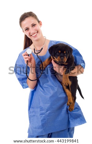 Brunette veterinary with a rottweiler puppy dog isolated on white background