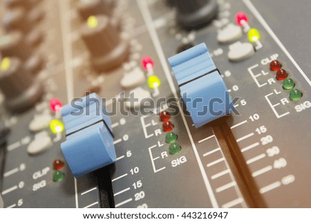 Closeup of slides audio mixer for DJ to use voice control. Photo Filter and Selective focus.