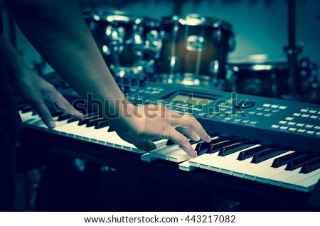 Closeup hands playing the keyboard or piano on brand music instrument background, music concept