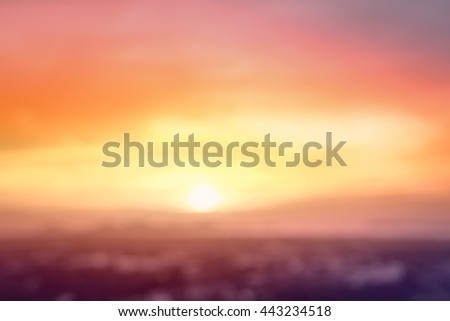 World environment day concept: Vintage style of abstract blur field on orange bokeh light mountain autumn sunset background