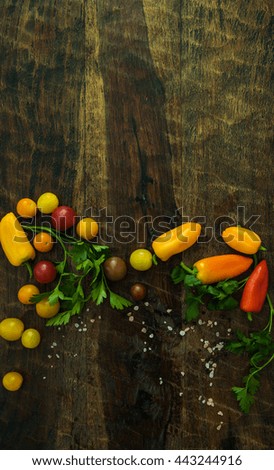 Healthy organic vegetables on a wood background from above