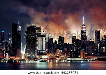 Fireworks show with Manhattan midtown skyscrapers and New York City skyline at night
