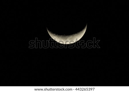 Crescent moon light closeup night time blur texture background