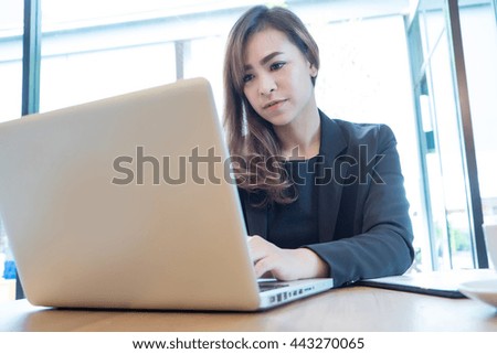 Portrait of businesswoman with laptop soft focus 