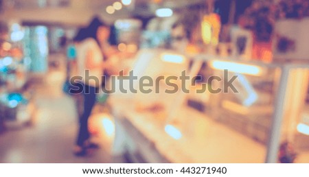 Customer in Coffee shop blur background with bokeh image.(vintage tone)