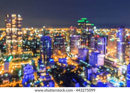 Bokeh night light of Bangkok Mahanakhon tower. Panoramic view light blue background of glass high rise building skyscraper commercial of future. Business concept of success industry tech architecture