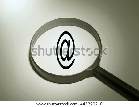 Magnifying glass with the word email. Searching email