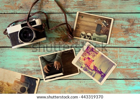 Photo album remembrance and nostalgia of hipster lifestyle journey trip in summer on wood table. instant photo of retro camera - vintage and retro style