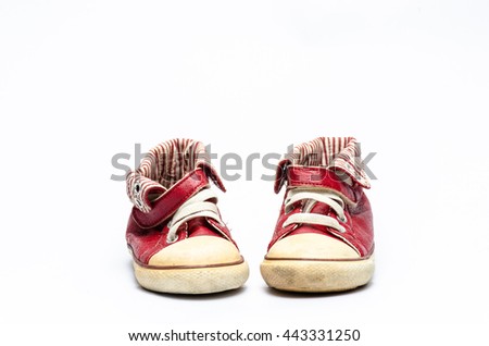 red children's leather shoes on a white background ,old sneaker