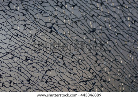 shot of a broken glass close-up. shattered durable glass.Blasted safety glass



