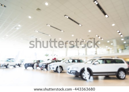 Blurred dealership store, with the cars and soft lightning Royalty-Free Stock Photo #443363680