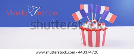 Happy Bastille Day red, white and blue cupcake with French flags,  sized to fit a popular social media cover image placeholder. 