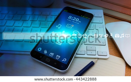 Internet icons and web bar over mobile phone in modern office