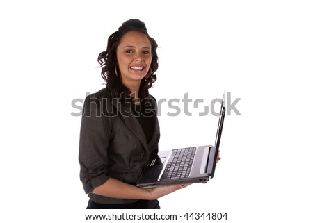 A business woman on her computer with a big smile on her face.