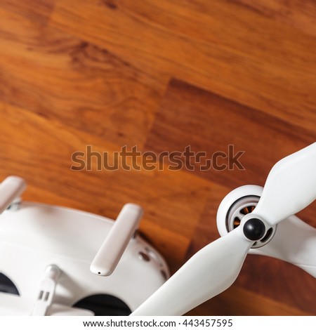 White Drone on wooden background 