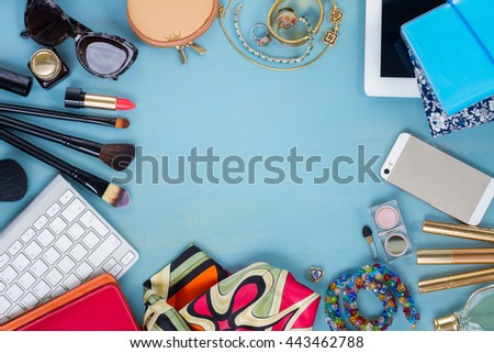 styled feminine desktop - woman fashion flat lay items on blue wooden background, copy space, top view