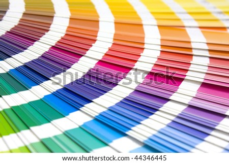 coloured swatches book open showing an array of rainbow colours