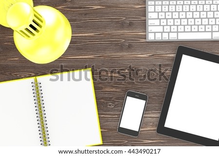 Office workplace set on black table. Pc, tablet, smartphone, notebook, yellow stationery, yellow glasses, cup of coffee, yellow lamp.