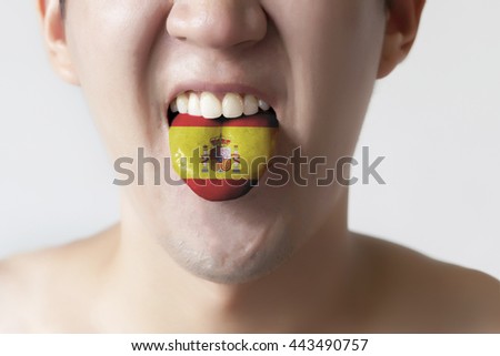 Spain flag painted in tongue of a man - indicating Spanish language and speaking
