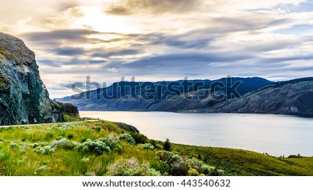 Sunset over Kamloops Lake along the Trans Canada Highway in British Columbia, Canada Royalty-Free Stock Photo #443540632