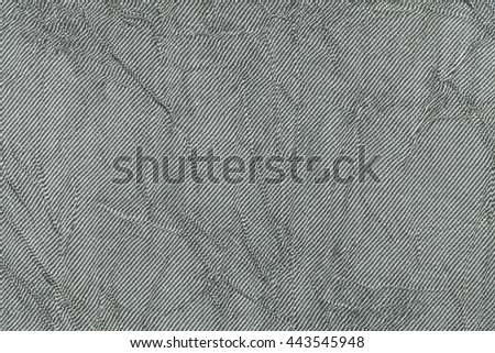 Light gray wavy background from a textile material. Fabric with natural texture closeup. Upholstery fabric pleated.