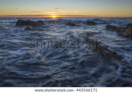 Seascape Croatia Dalmatia Europe. Nature and landscape photo of Adriatic Sea. Beautiful colorful sunset and lovely waves in the ocean. Warm summer evening with nice sky. Calm and peaceful picture.