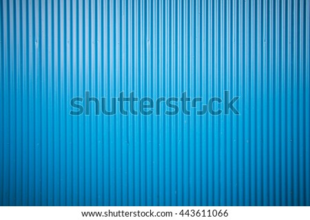 Corrugated metal sheet wall background texture inside of building Royalty-Free Stock Photo #443611066