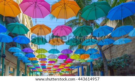 port louis le caudan waterfront umbrellas capital of Mauritius. Royalty-Free Stock Photo #443614957