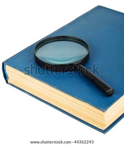 Blue book and magnifying glass isolated on the white
