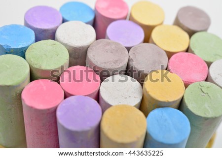 Macro picture of chalks in a variety of colors on a white background. Drawing rainbow. Back to school,education, arts, creative