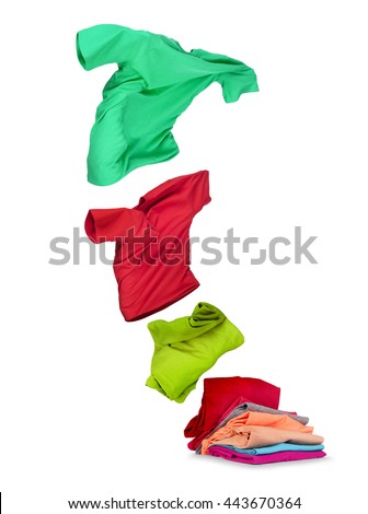 clothes fly out of pile on white background 