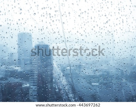 City views of rain or water drops on a window glass.