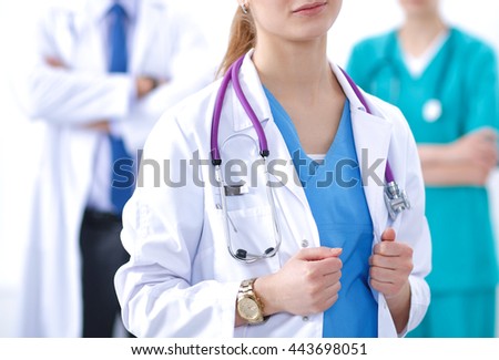 Attractive female doctor in front of medical group