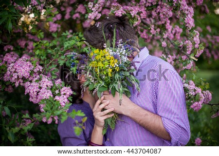 Young cerative couple gathered colored bouquet