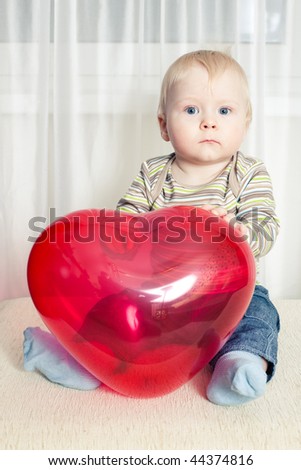 funny boy with heart balloon