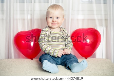 funny boy with heart balloons