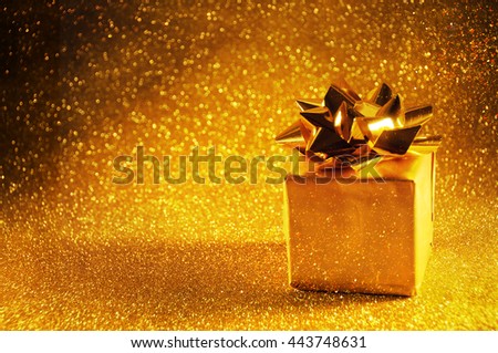 close up of gift box bow on shiny background