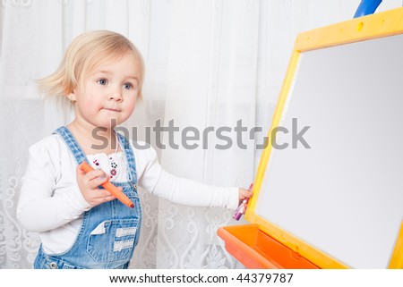 Girl draws on the board