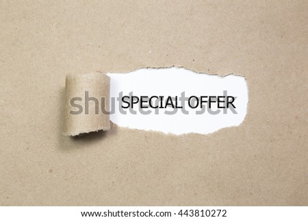 Special Offer appearing behind torn paper. Royalty-Free Stock Photo #443810272