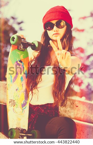 Skater girl doing peace sign