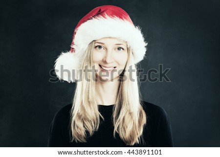 Happy Woman in Santa Hat. Christmas Concept